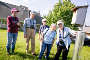 Renate- 2nd from right- and others checking out bluebird houses on Kendal grounds