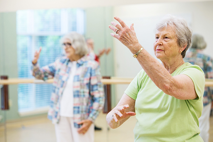 Female residents doing tai chi together