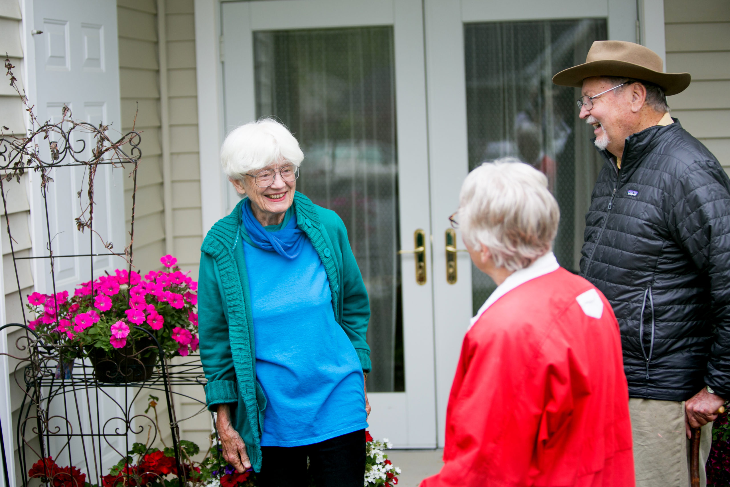 Three Residents Talking Outdoors