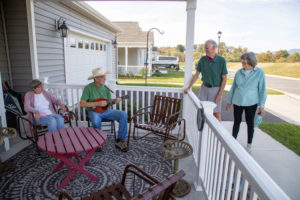 residents playing music on porch