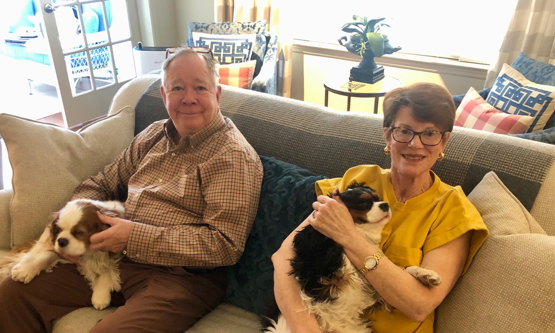 couple with dogs on couch