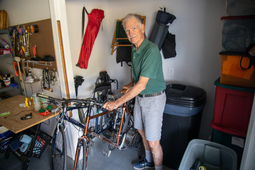 man with bike in garage