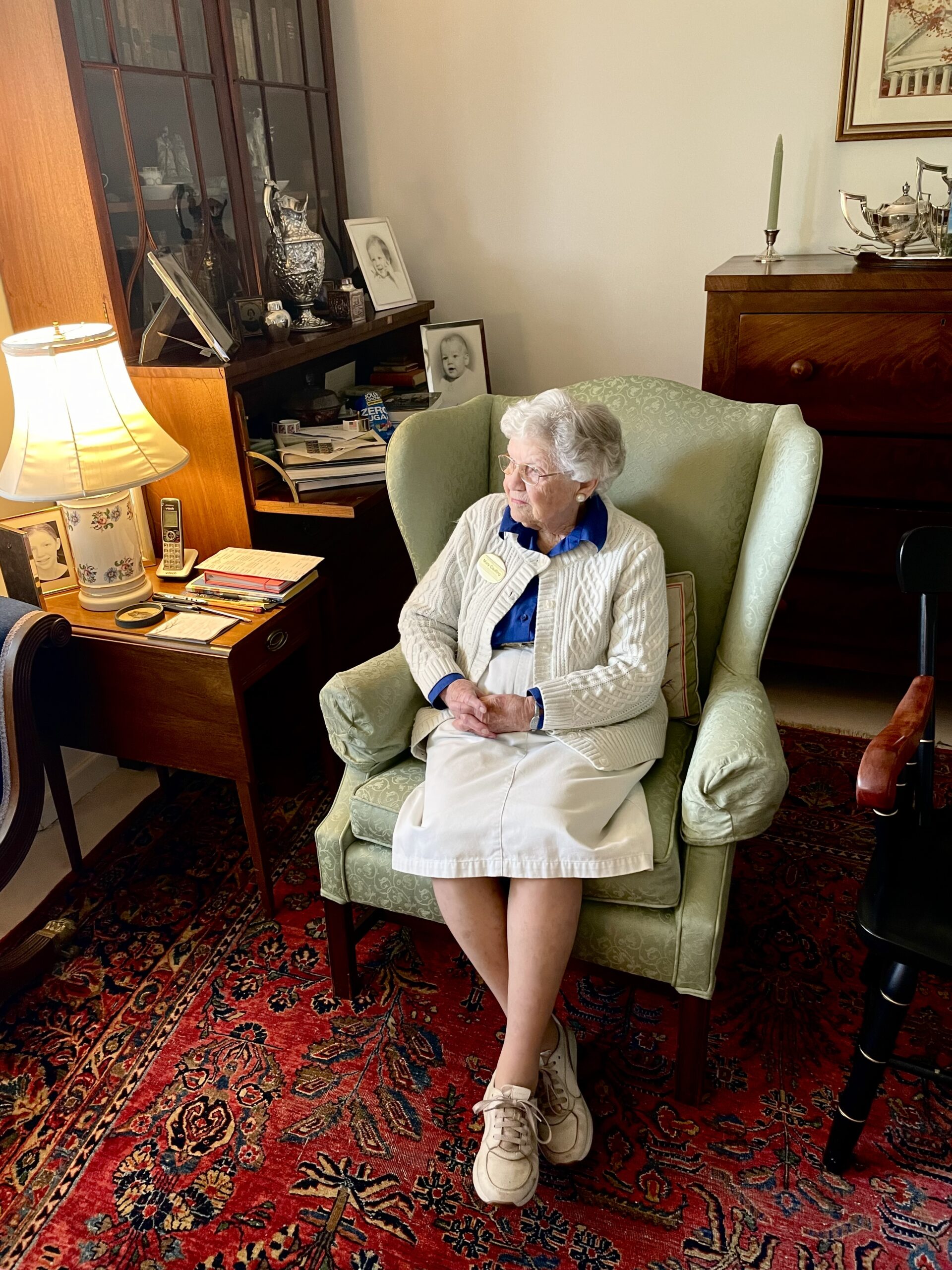Mary Coulling, age 95, sits in her cottage and poses for a photo.