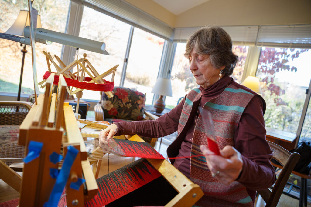 resident works on project for arts and crafts fair.