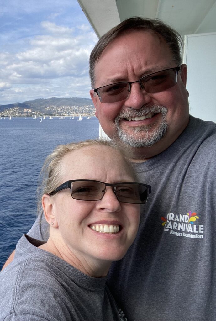 Brian and Becky burton pose on a cruise