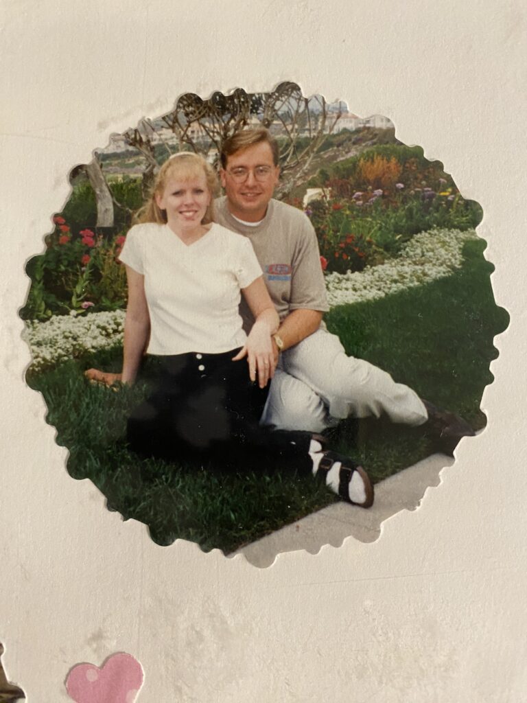 A young Becky and Brian Burton posing for a photo