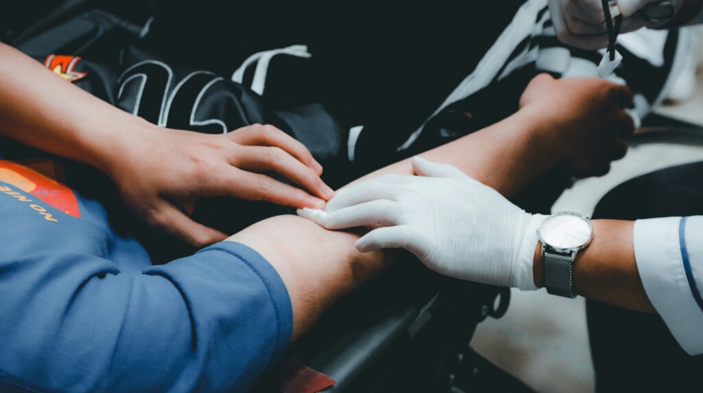 photo of an arm getting blood drawn.