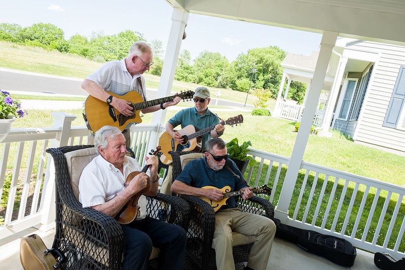 Resident band plays on front porch of cottage on Sunrise Ridge.