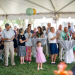 Crowd celebrating under the big tent