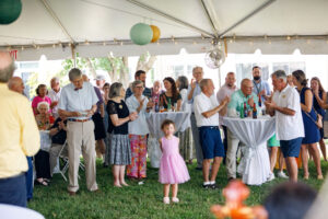 Crowd celebrating under the big tent